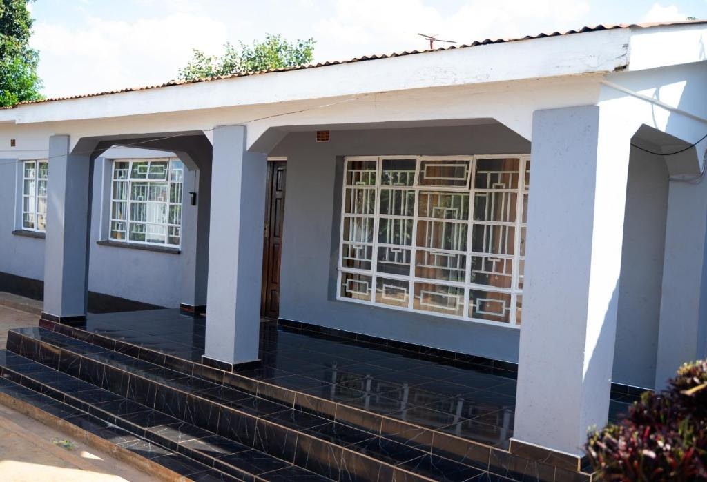 Front of The Grande 49, with tiled veranda and columns