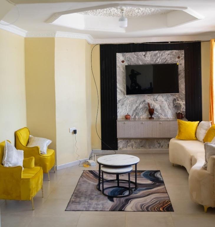 Living room seating area with yellow armchairs